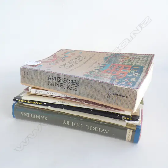 Assorted booklets on samplers plus two books.